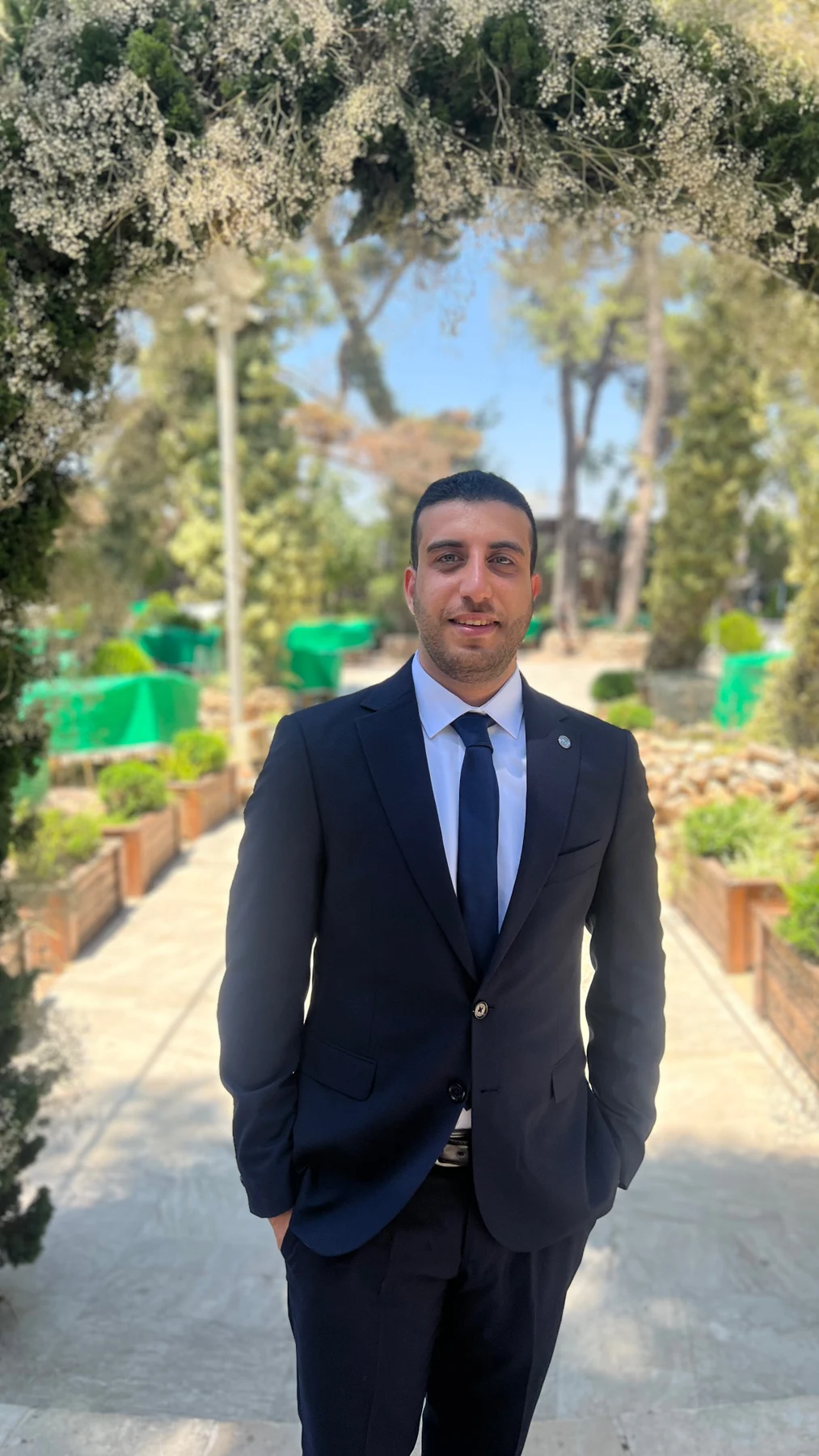 Ramzi Tannous wearing a navy suit outdoors
